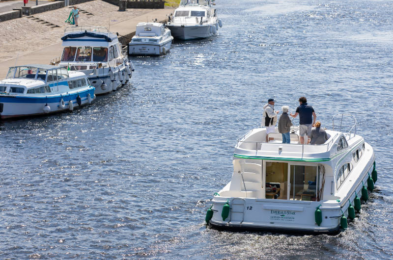 people on boats on river