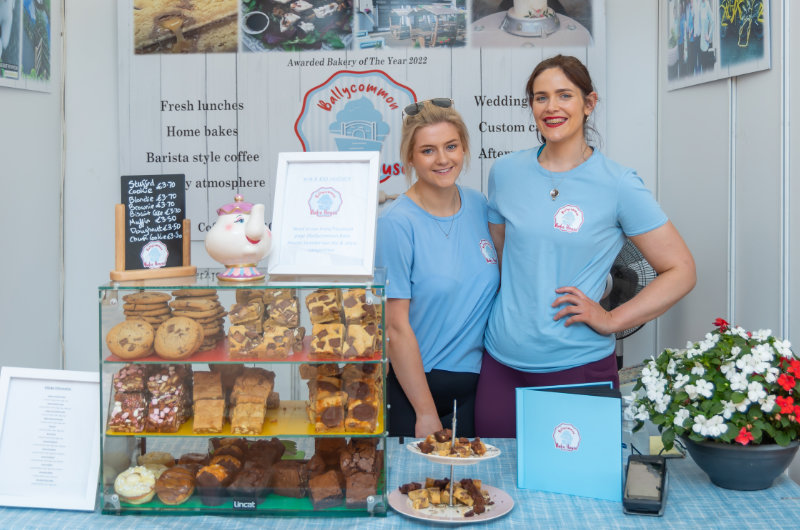 two women at cookie and cake stall